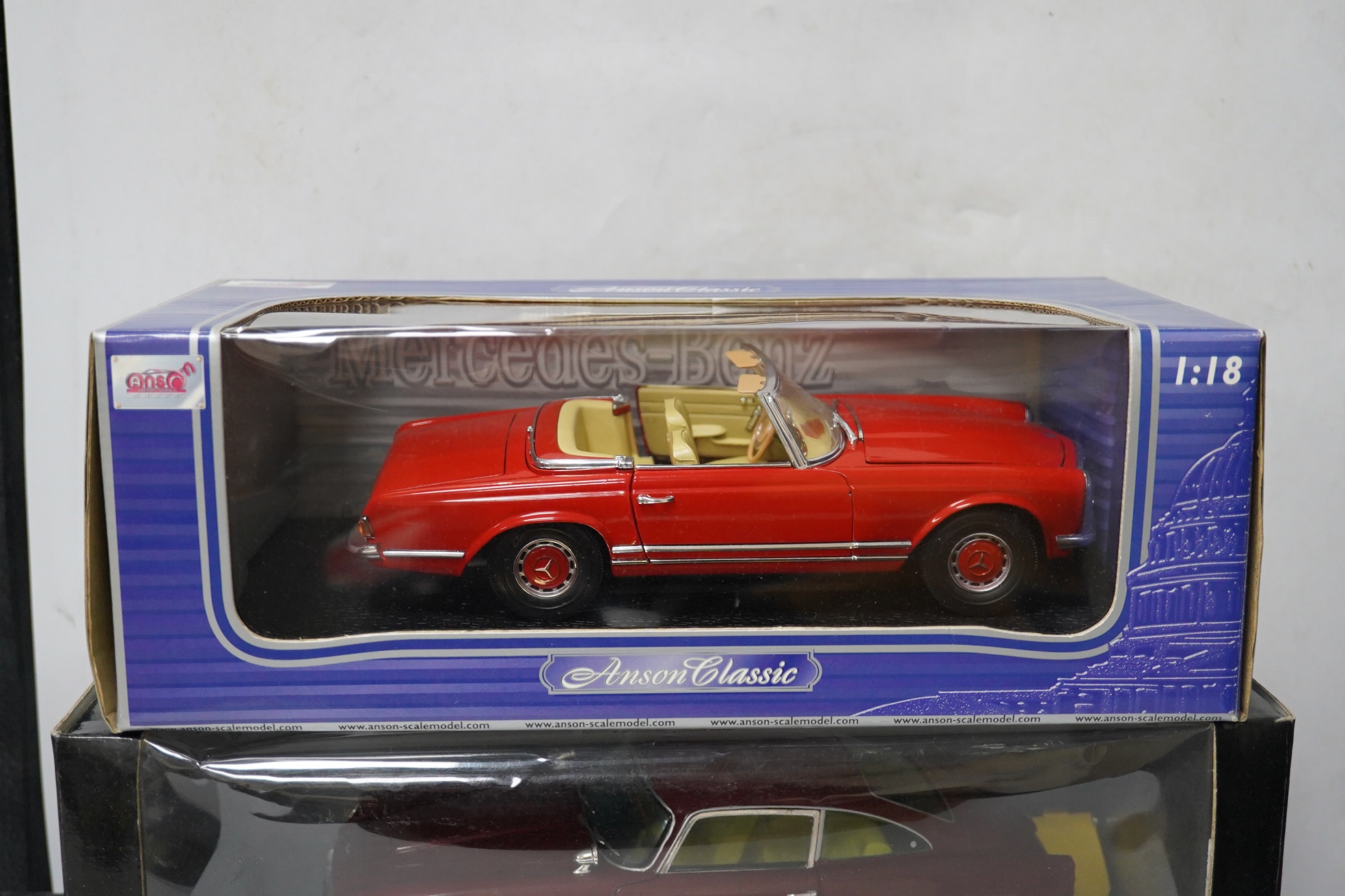 Five boxed large scale diecast cars; a 1:16 scale Franklin Mint 1905 Rolls-Royce 10hp, with one wheel detached and one side lamp detached (both present), together with four 1:18 scale cars; a Chrono Aston Martin DB5, a R